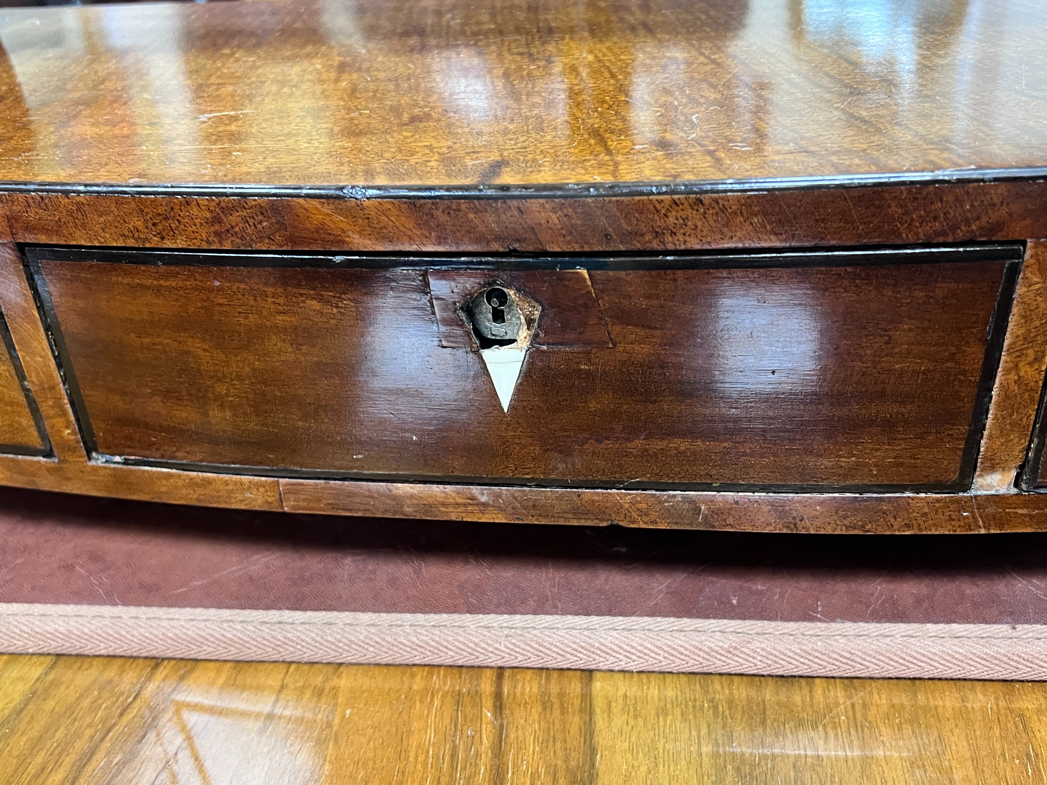 A Regency mahogany bow front box base toilet mirror, width 58cm, depth 23cm, height 51cm